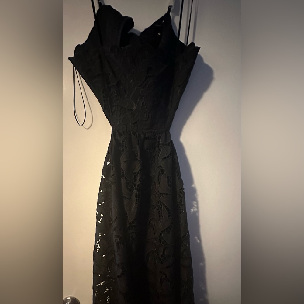 NEW with tags - black crochet open back dress with bow detail. Express brand